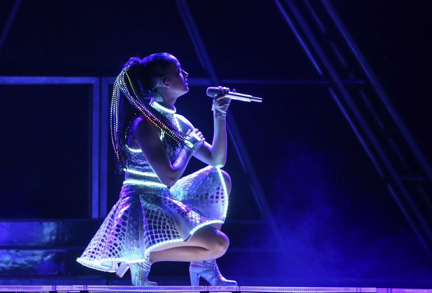 Katy Perry gets low mid-performance at a Philadelphia concert that was part of her Prismatic World Tour.