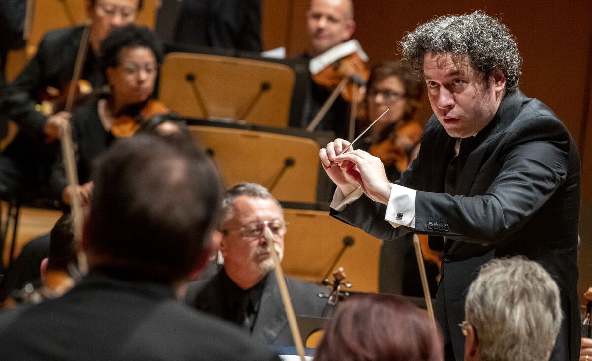 Gustavo Dudamel conducts the L.A. Phil during performance of Andrew Norman’s centennial commission, “Sustain,” at Walt Disney Concert Hall in Los Angeles on Nov. 2.