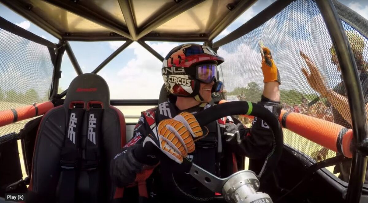 Motorcycle stunt rider Phil “Smagical” Smage gives a high-five to friends moments before he suffered a devastating crash in RAZR vehicle jump attempt in 2018. This scene is featured in the first episode of “Road 2 Recovery,” a web series spotlighting the work Encinitas charity Road 2 Recovery has done over the past 20 years to help athletes recover from career-ending injuries.