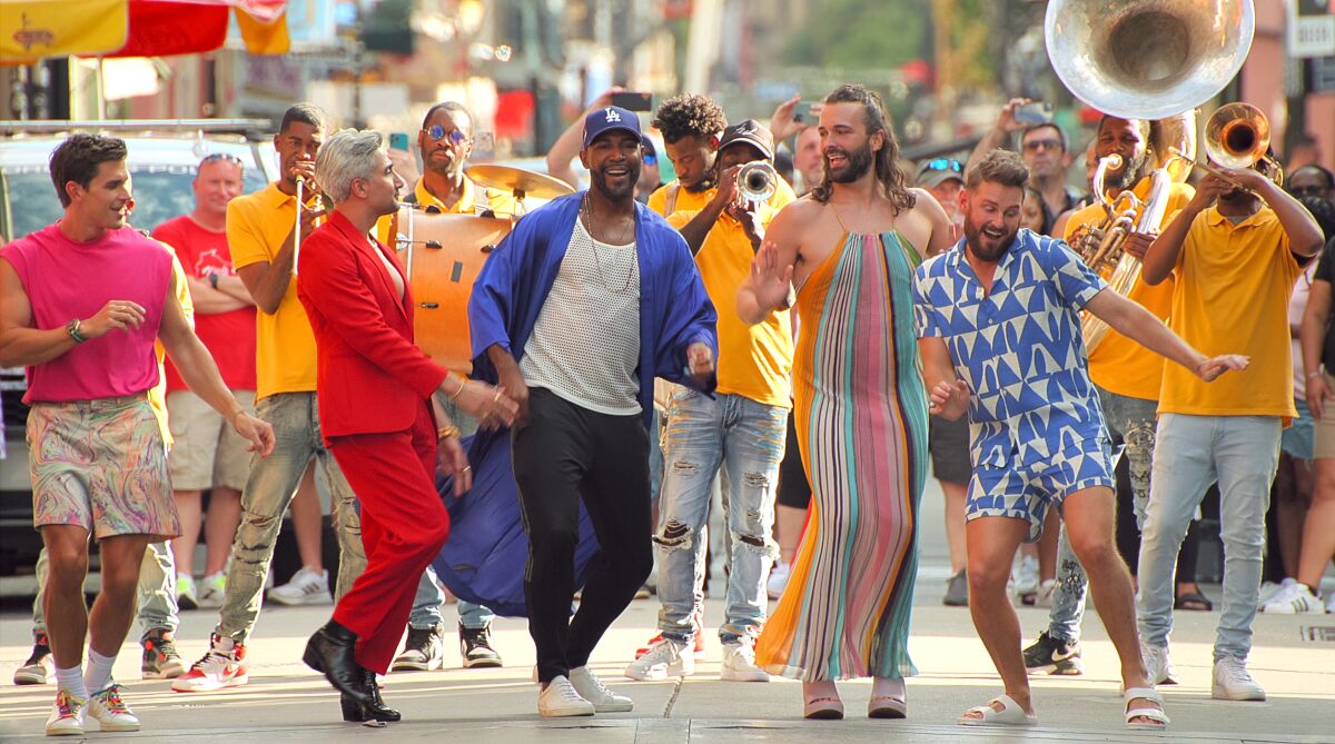 The hosts of "Queer Eye" wear colorful outfits as they dance in a New Orleans second line.