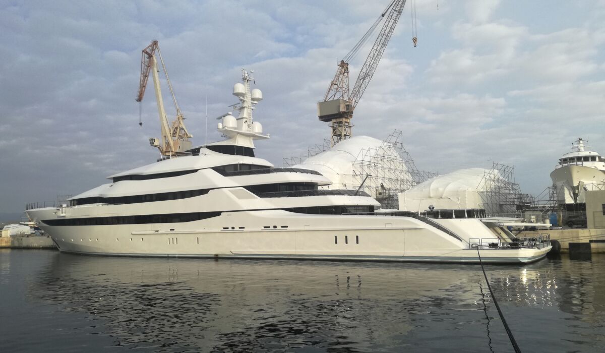 Amore Vero, a massive pearl-white luxury yacht linked to Russian oligarch Igor Sechin, sits in dock.
