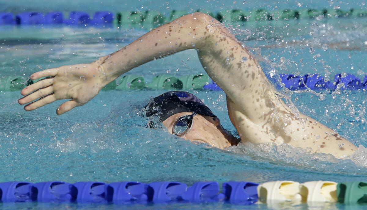 Nathan Schrimsher, a top U.S. pentathlete, competes in the 200-meter swim portion at The Claremont Club during the Modern Pentathlon World Cup. The modern pentathlon comprises five events -- swimming, fencing, cross-country running, shooting and show jumping.