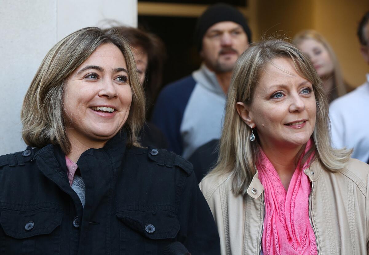 Cari Searcy, left, and Kim McKeand, plaintiffs in the case that struck down Alabama's same-sex marriage ban, hold a news conference Jan. 26 in Mobile.