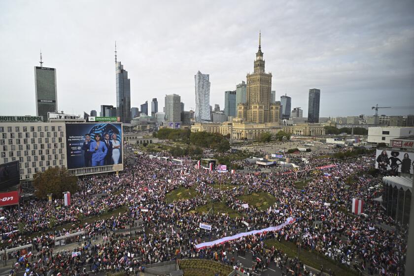 Thousands of people gather for a march to support the opposition against the governing populist Law and Justice party in Warsaw, Poland, Sunday, Oct. 1, 2023. Polish opposition leader Donald Tusk seeks to boost his election chances for the parliament elections on Oct. 15, 2023, leading the rally in the Polish capital. (AP Photo/Rafal Oleksiewicz)