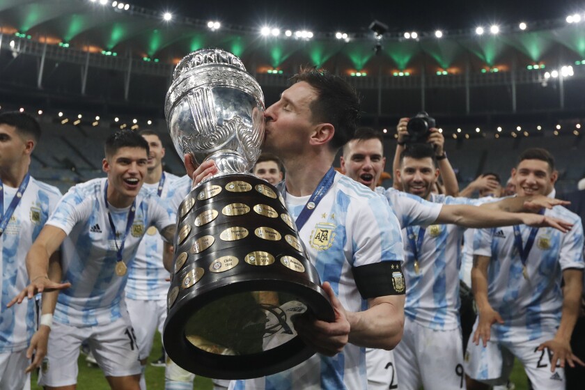 Lionel Messi kisses the title trophy after Argentina beat Brazil 1-0 in the Copa America final Saturday in Rio de Janeiro.