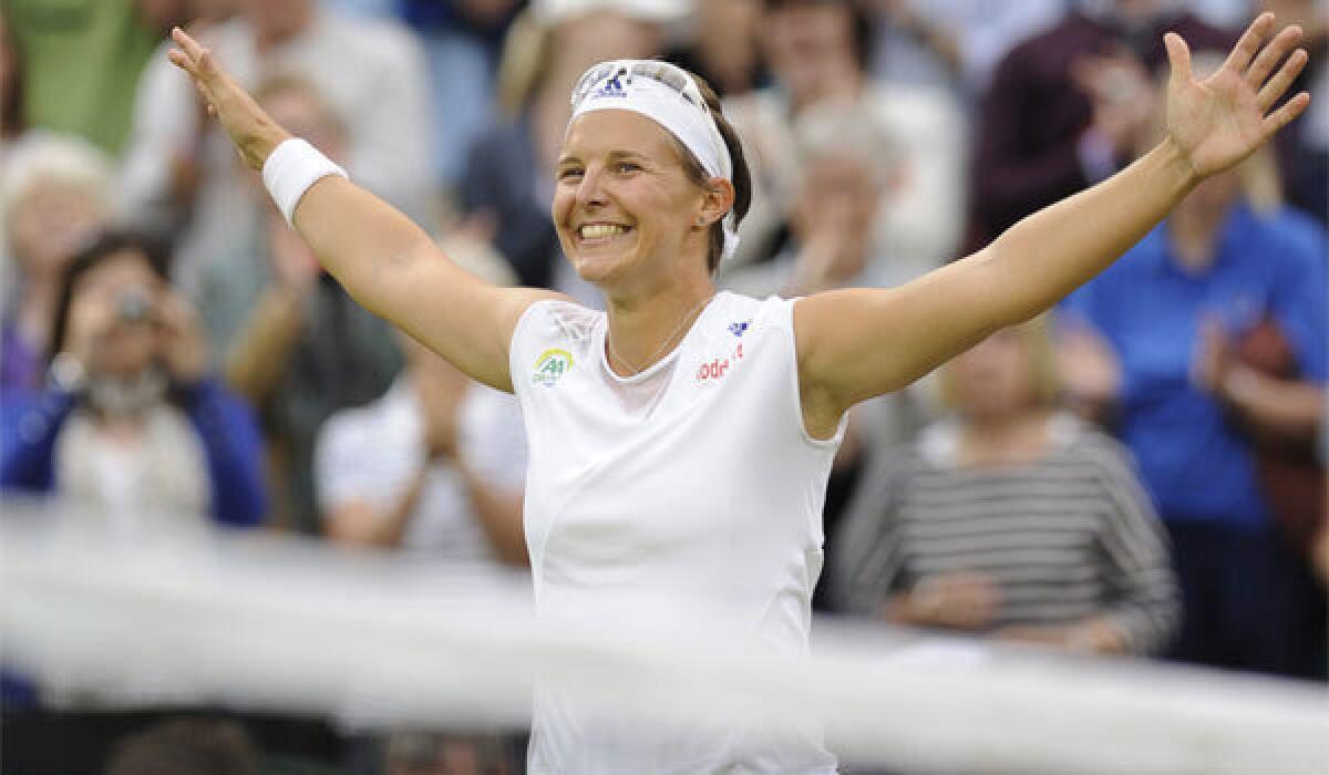 Belgium's Kirsten Flipkens celebrates after defeating Petra Kvitova of the Czech Republic in the Wimbledon quarterfinals.