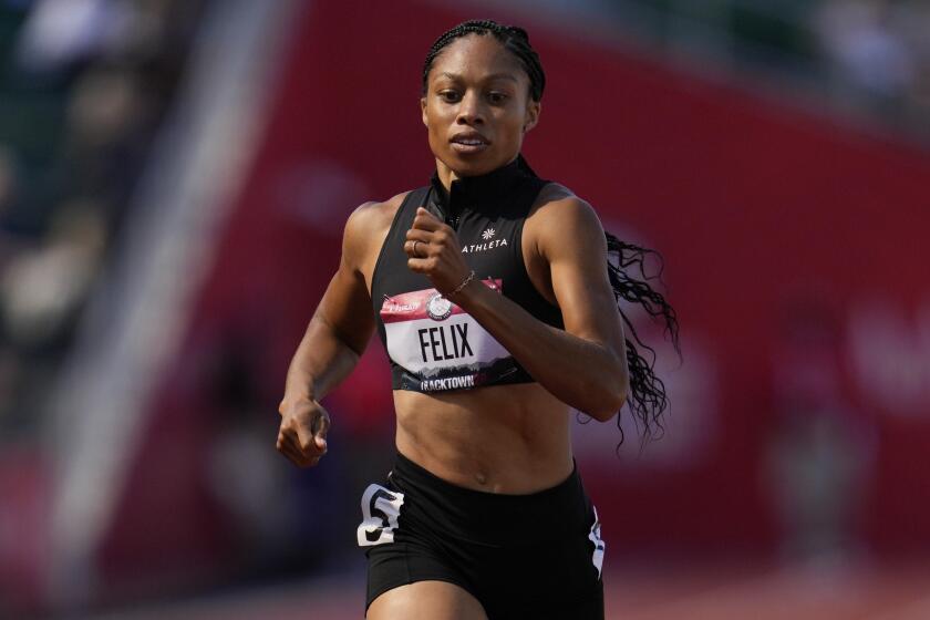 Allyson Felix win the first heat of the women's 400-meter run at the U.S. Olympic Track and Field Trial.