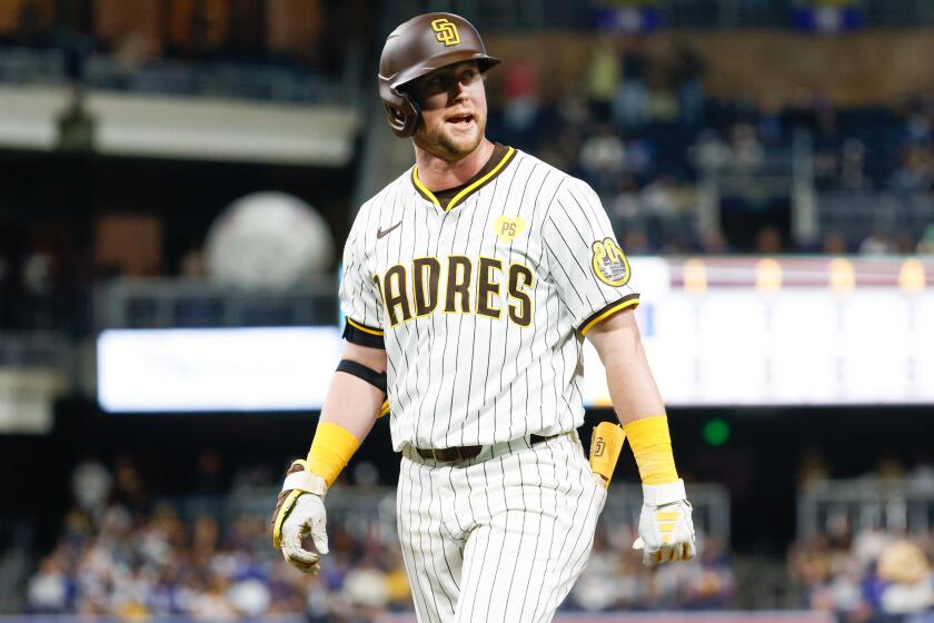 San Diego, CA - April 09: San Diego Padres first baseman Jake Cronenworth (9) walks back to the dugout after flying out against the Chicago Cubs during the ninth inning at Petco Park on Tuesday, April 9, 2024 in San Diego, CA. (Meg McLaughlin / The San Diego Union-Tribune)