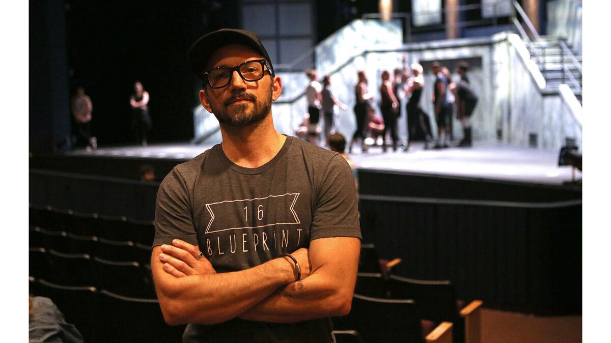 Director Andrew Palermo, a UCI assistant professor who specializes in musical theater choreography and dance, supervises a rehearsal of "American Idiot" at UCI's Claire Trevor Theater.