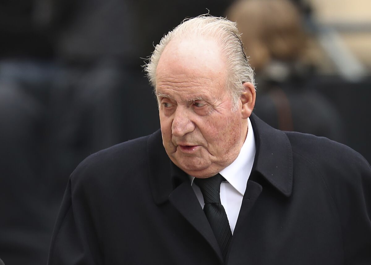 FILE - Spain's former King Juan Carlos, leaves the Notre Dame cathedral in Luxembourg, after attending the funeral of the Grand Duke Jean of Luxembourg, on May 4, 2019. Spanish prosecutors are shelving two investigations into alleged financial wrongdoing in Juan Carlos I's business dealings that prompted the former monarch to leave Spain and move to Abu Dhabi. Prosecutors said Wednesday March 2, 2022 that they didn't find evidence that could be prosecuted because the monarch was protected by immunity until his abdication eight years ago and because any possible fraud fell out of the statute of limitations. (AP Photo/Francisco Seco, File)