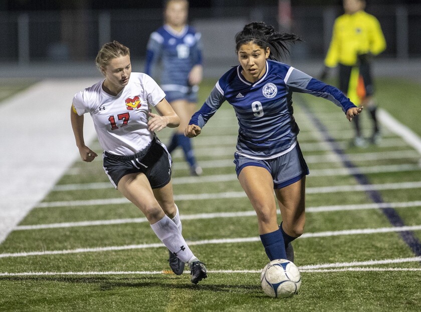 Newport Harbor senior Skylynn Rodriguez, shown dribbling against Mission Viejo on Feb. 6, leads the Sailors with 12 goals this season.