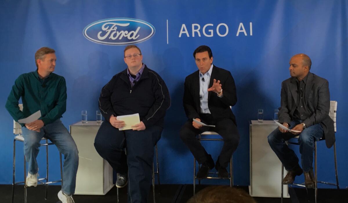 From left: Argo AI Chief Operating Office Peter Rander and Chief Executive Bryan Salesky, the firm's founders, with Ford CEO Mark Fields and Chief Technical Officer Raj Nair as they announce their partnership in San Francisco on Friday.