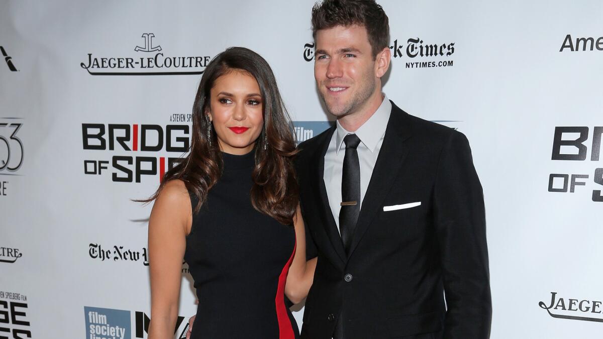 Nina Dobrev and Austin Stowell made their relationship red carpet official at the premiere of "Bridge of Spies" on Oct. 4, 2015, in New York.