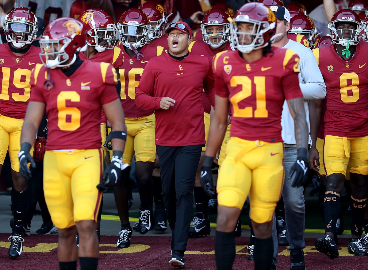 USC interim head football coach Donte Williams takes the field with his Trojans squad.