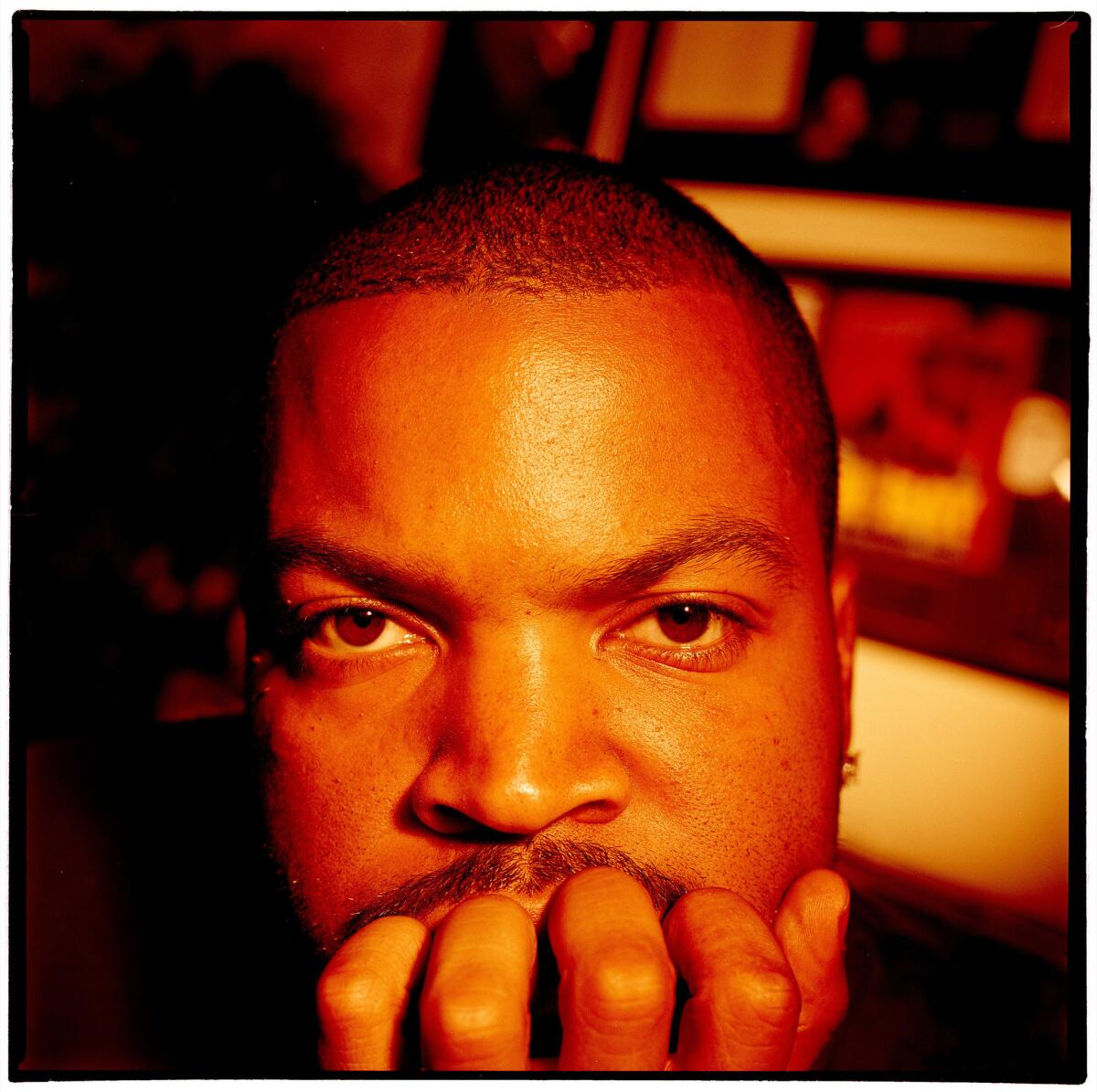 Rapper and actor Ice Cube sits in the den of the home where he grew up in Inglewood in this L.A. Times archived photo. (Genaro Molina / Los Angeles Times)