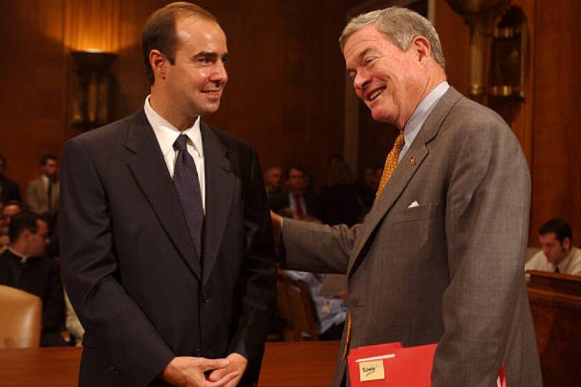 UNITED STATES - OCTOBER 02: At left, Eugene Scalia, nominee for Solicitor of Labor, gets encouragement from Sen. Kit Bond, R-Mo., before Scalia's conformation hearing. (Photo By Tom Williams/Roll Call/Getty Images)