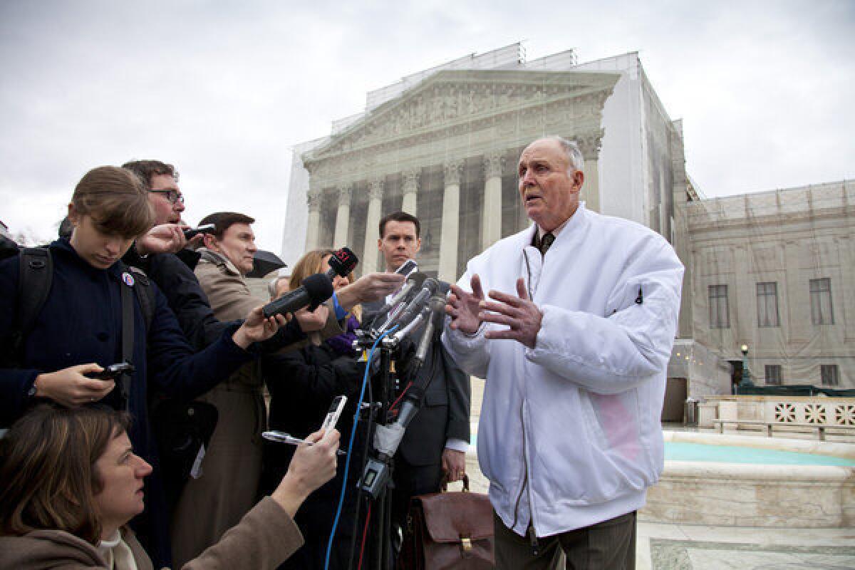 Vernon Bowman, an Indiana soybean farmer, speaks with reporters outside the Supreme Court in February. The court ruled Monday that the farmer violated Monsanto Co.'s patents on soybean seeds resistant to its weed killer.