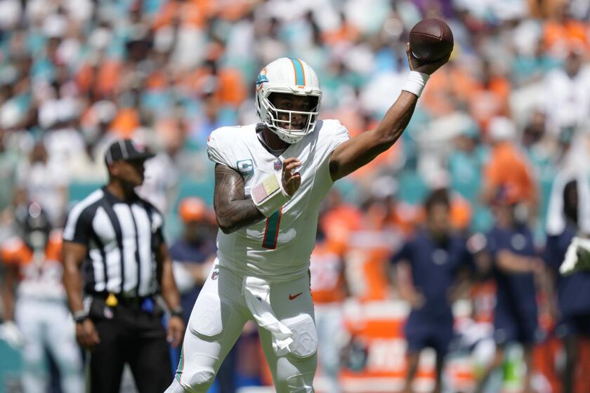 Miami Dolphins quarterback Tua Tagovailoa (1) aims a pass during the first half of an NFL football game against the Denver Broncos, Sunday, Sept. 24, 2023, in Miami Gardens, Fla. (AP Photo/Rebecca Blackwell)