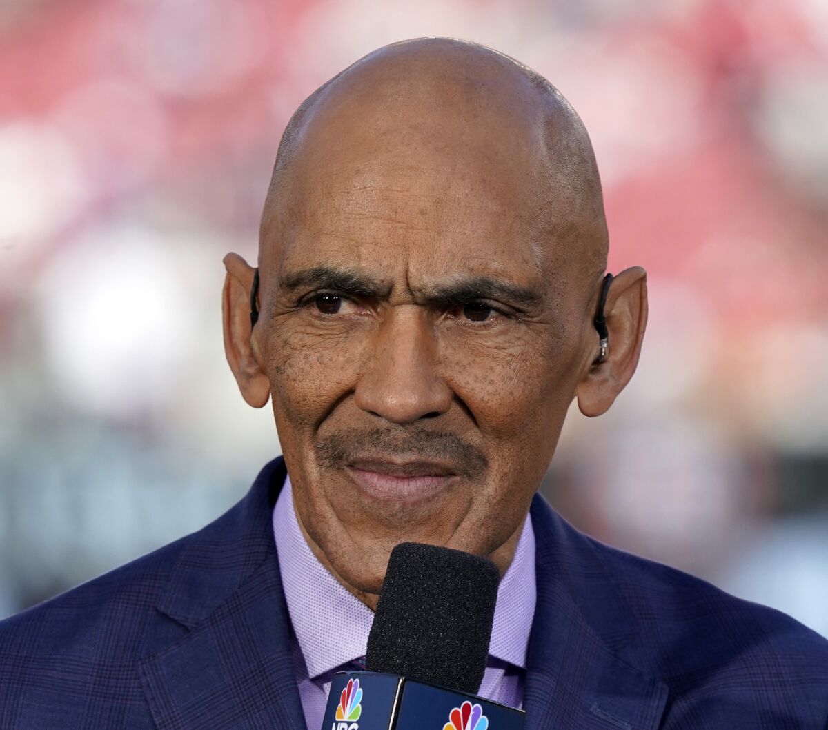 FILE - Tony Dungy looks on before an NFL divisional playoff football game between the San Francisco 49ers and the Minnesota Vikings, Saturday, Jan. 11, 2020, in Santa Clara, Calif. Hall of Fame coach Dungy learned long ago the need to know how to handle credit and blame. (AP Photo/Tony Avelar, File)