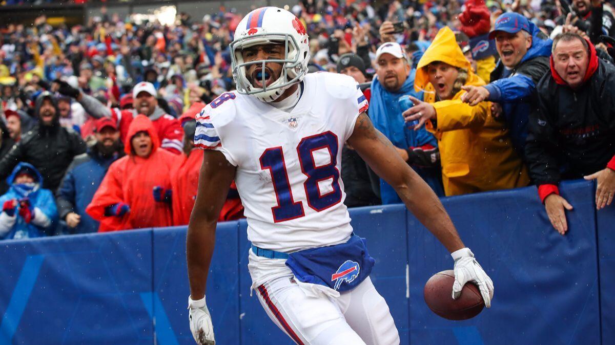 Buffalo Bills' Andre Holmes celebrates after scoring a touchdown during the second quarter against the Oakland Raiders on Sunday.