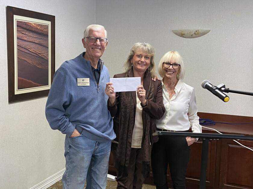 Kiwanis Club of La Jolla members Wally Matranga and Susan Callahan (right) with Uli Heine of Global Communities