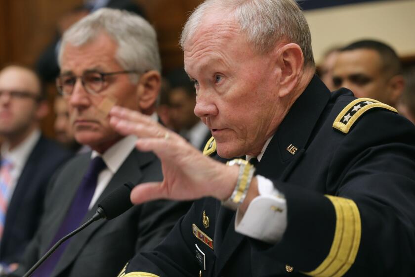 Gen. Martin Dempsey, chairman of the Joint Chiefs of Staff, testifies about the fight against Islamic State before the House Armed Services Committee on Thursday alongside Defense Secretary Chuck Hagel.
