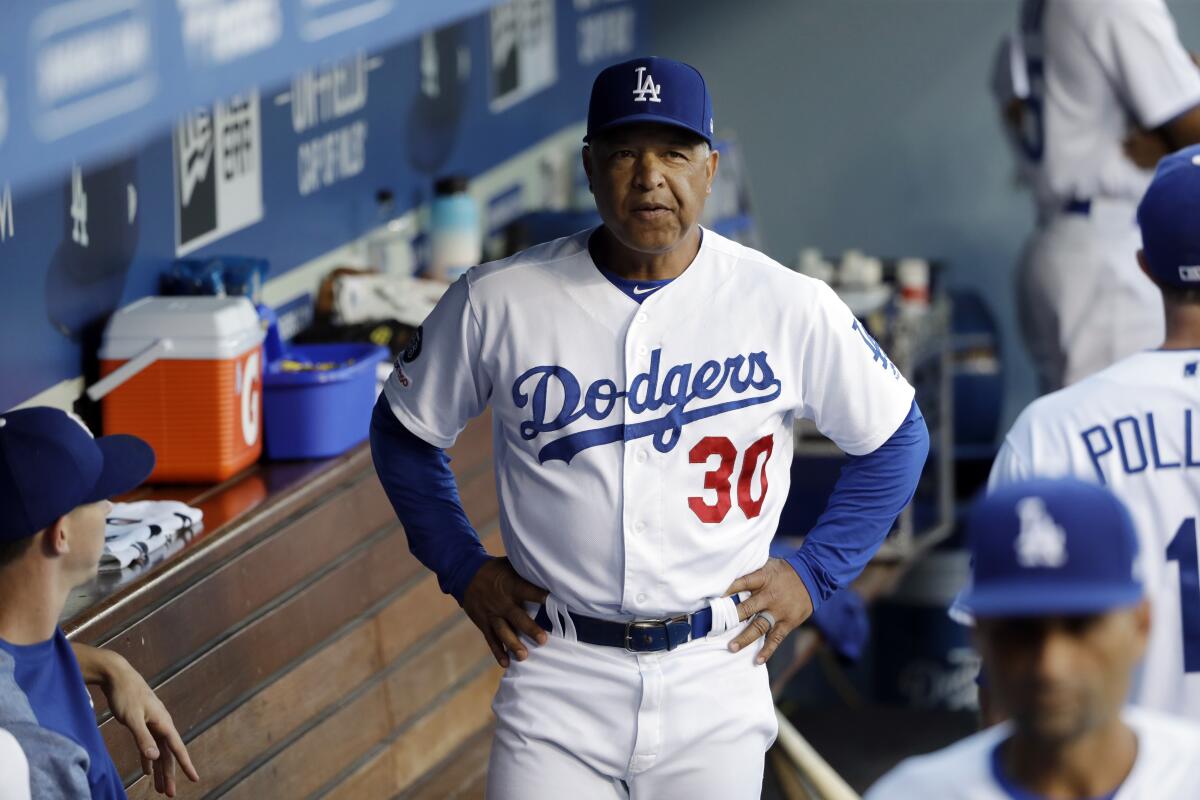 Dodgers manager Dave Roberts in the dugout during a game against the Angels on July 23, 2019. 