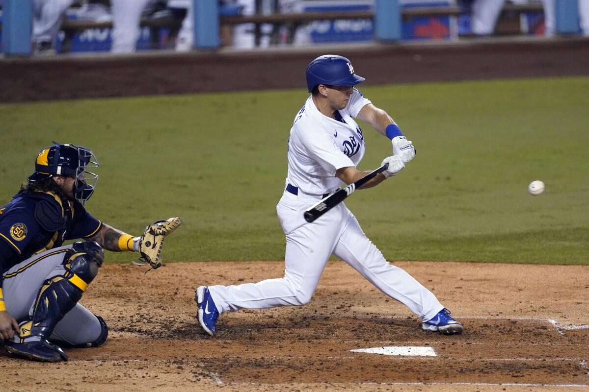 Dodgers catcher Austin Barnes hits a run-scoring single during the fifth inning.
