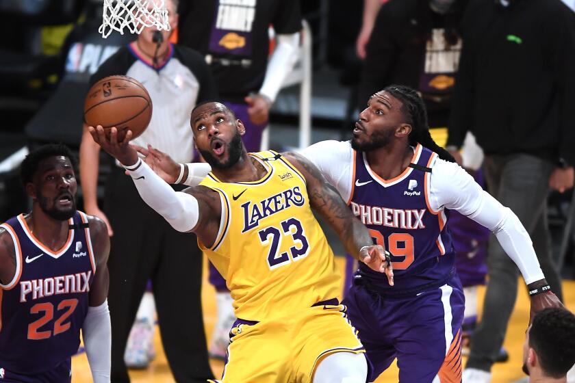 Lakers LeBron James scores on Suns Jae Crowder