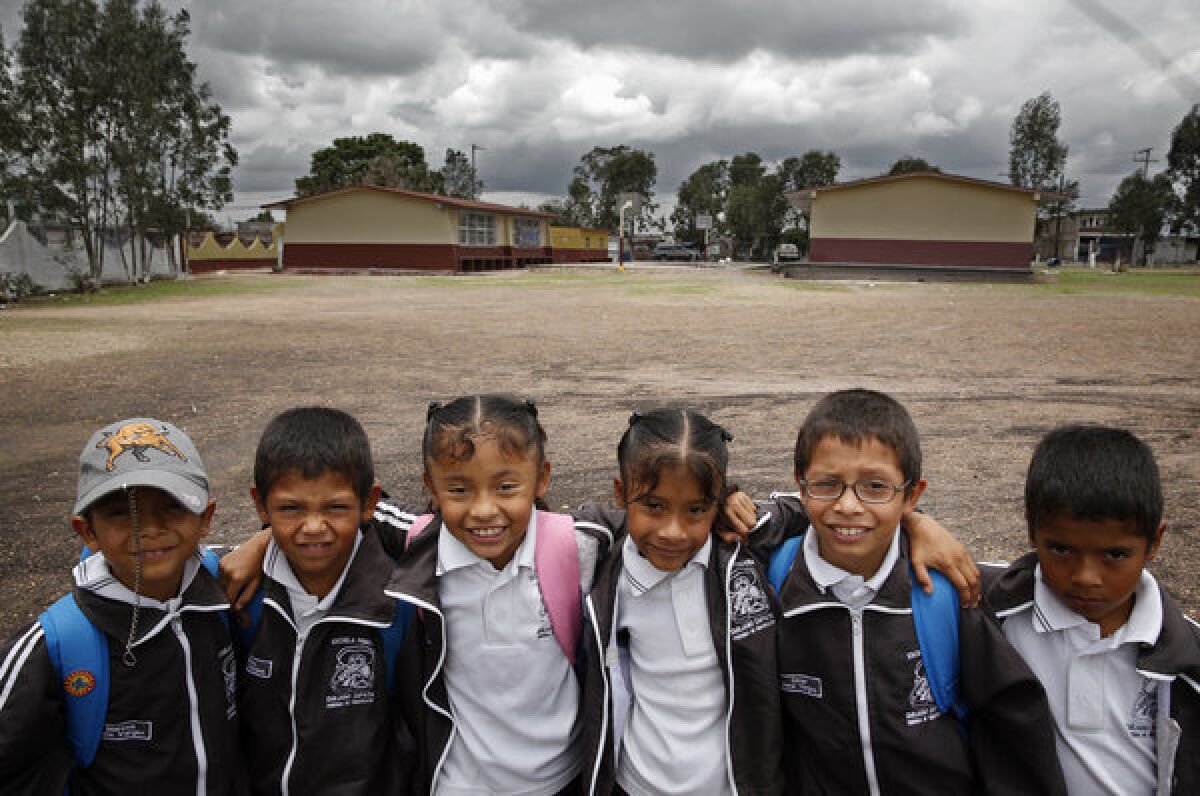 The 8-year-old Ireta sextuplets at their schoolyard in a small ranching village near Irapuato, Mexico. Left to right, Marcos, Carlos, Teresa, Maria, Omar and Noe.
