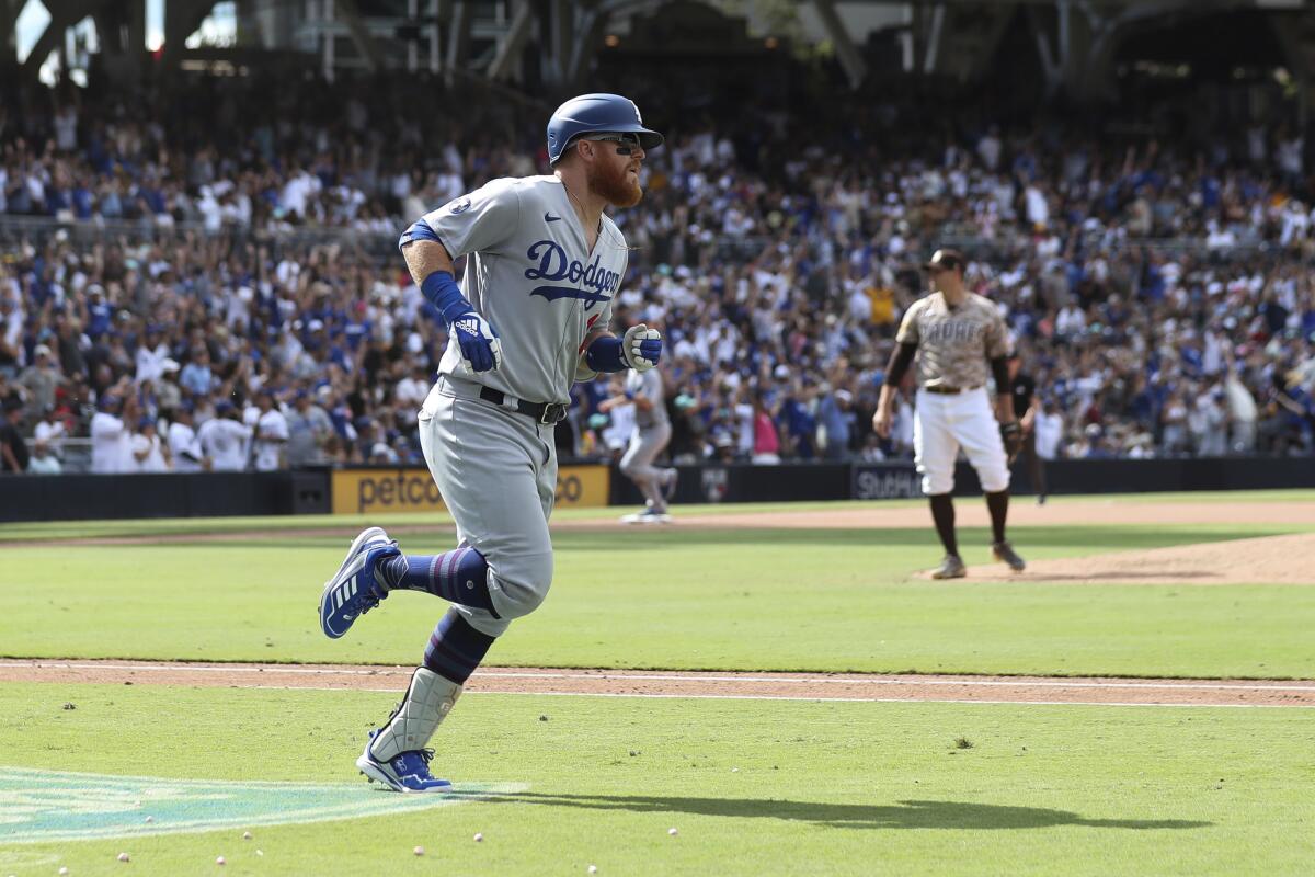 Dodgers' Justin Turner runs the bases after hitting a grand slam off San Diego Padres' Craig Stammen.