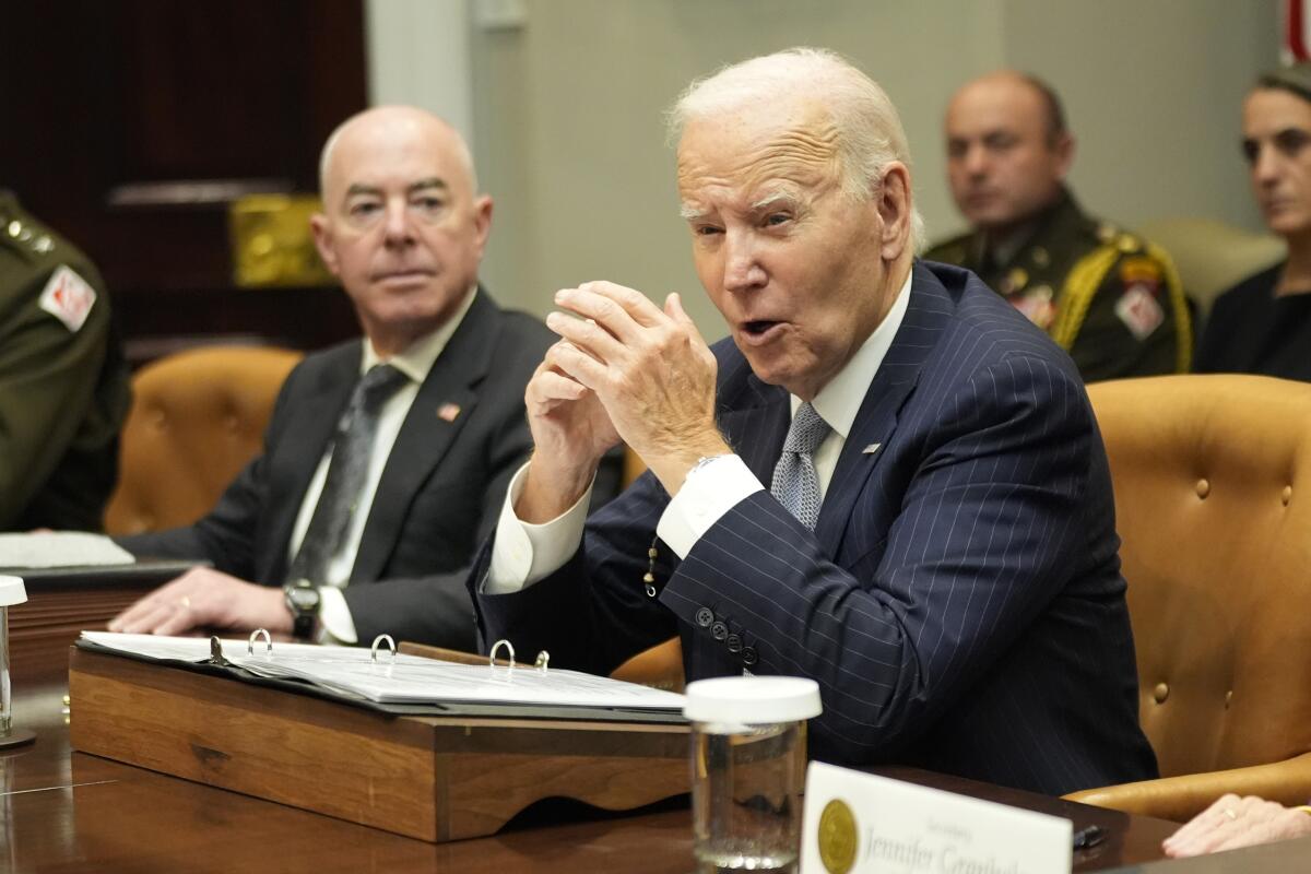 President Biden and Homeland Security Secretary Alejandro N. Mayorkas in the Roosevelt Room of the White House.