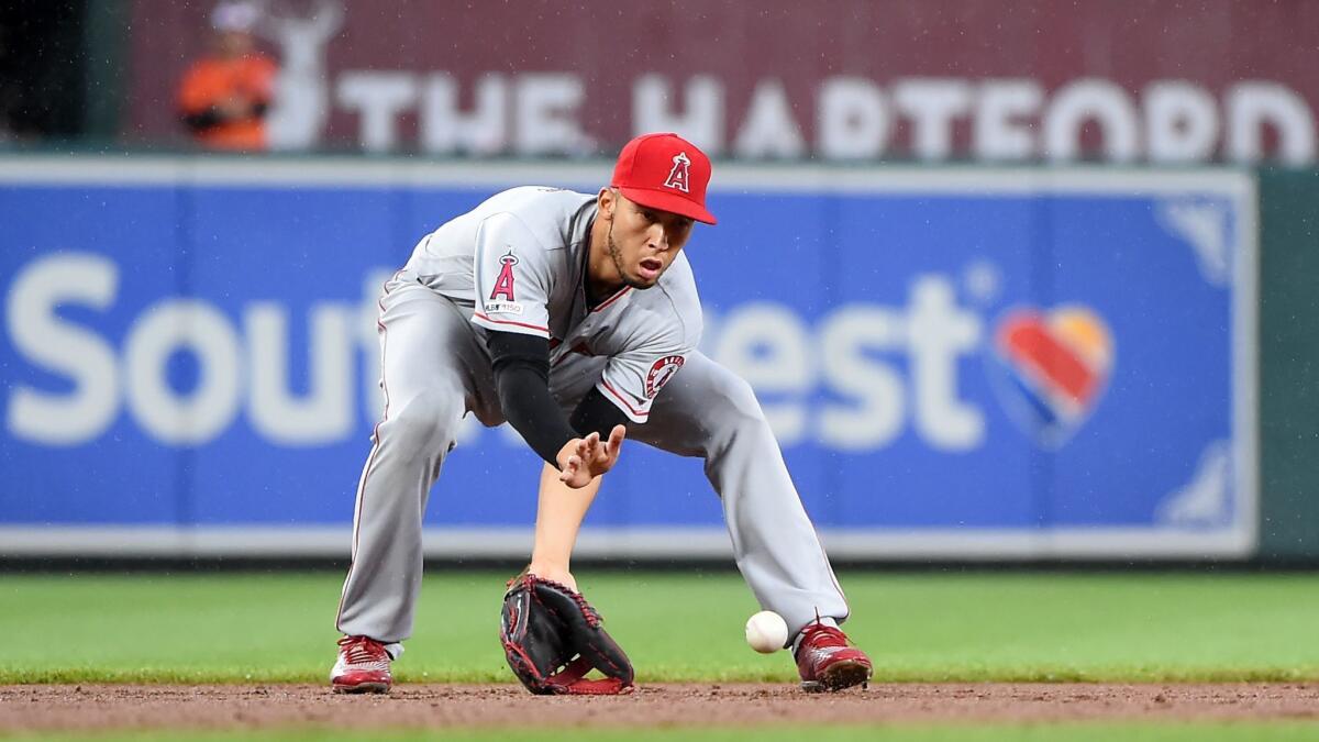Angels' Andrelton Simmons fields a ground ball in the eighth inning against the Baltimore Orioles on Saturday in Baltimore.