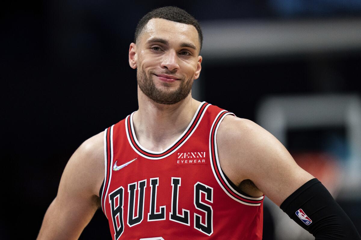 FILE - Chicago Bulls guard Zach LaVine pauses during the second half of the team's NBA basketball game against the Charlotte Hornets in Charlotte, N.C., Wednesday, Feb. 9, 2022. The NBA's free agency period opens Thursday night, June 30, 2022, with teams and players finally free to negotiate new deals. (AP Photo/Jacob Kupferman, File)