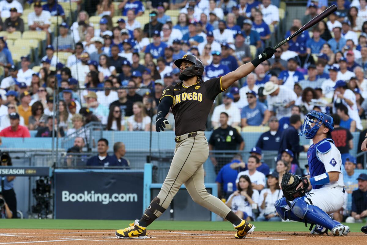 San Diego's Fernando Tatis Jr. follows through on a solo home run in the first inning Sunday.