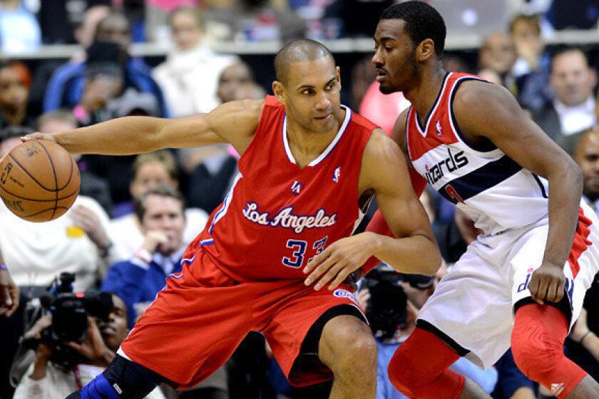 Clippers forward Grant Hill, working against Washington Wizards point guard John Wall during a game last season, announced his retirement after playing 18 NBA seasons.