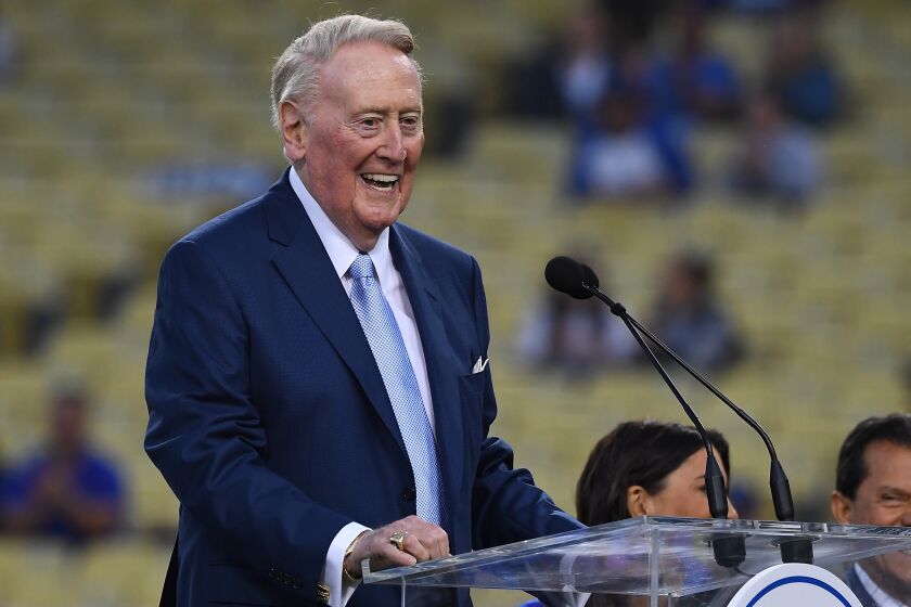 LOS ANGELES, CA - SEPTEMBER 21: Retired Dodgers broadcaster Vin Scully, left speaks during a pregame ceremony honoring language broadcaster Jaime Jarrin inducting him into the Dodger Stadium Ring of Honor at Dodger Stadium on September 2, 2018 in Los Angeles, California. (Photo by Jayne Kamin-Oncea/Getty Images)