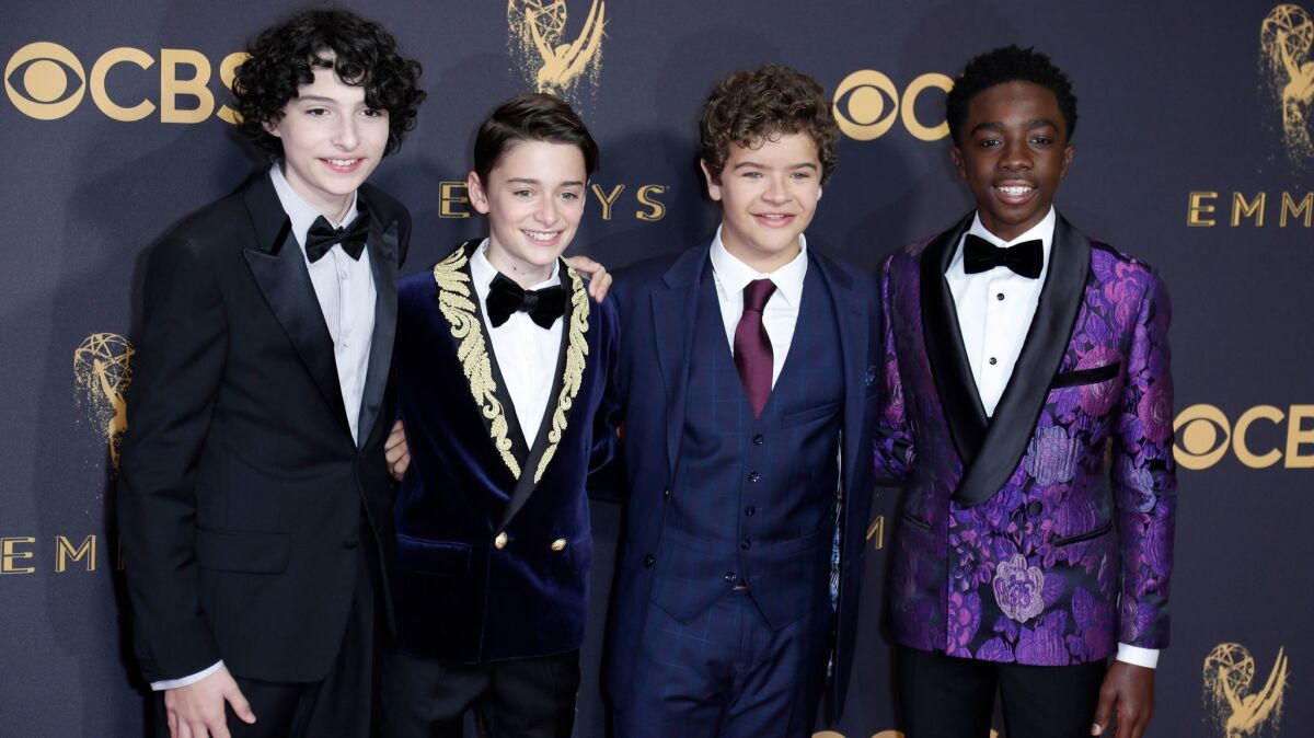 "Stranger Things" actors Finn Wolfhard, from left, Noah Schnapp, Gaten Matarazzo and Caleb McLaughlin were among the night's sartorial standouts.
