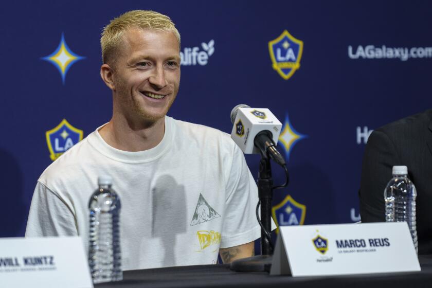 German free-agent midfielder Marco Reus smiles as he is introduced as the new Los Angeles Galaxy soccer player during a news conference at Dignity Health Sports Park in Carson, Calif., Friday, Aug. 16, 2024. (AP Photo/Damian Dovarganes)