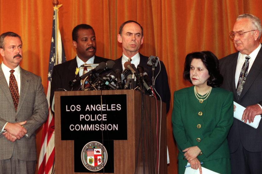 Raymond Fisher, centyer, president of the Los Angeles Police Commission is flanked by other members of commission at Parker Center press conference Monday at which he announced commission's decision not to reappoint Chief Willie Williams to a second term. From left to rt., Art Mattox, T. Warren Jackson, Fisher, Edith Perez and Herberft F. Boeckmann.Mandatory Credit: Ken Lubas/The LA Times