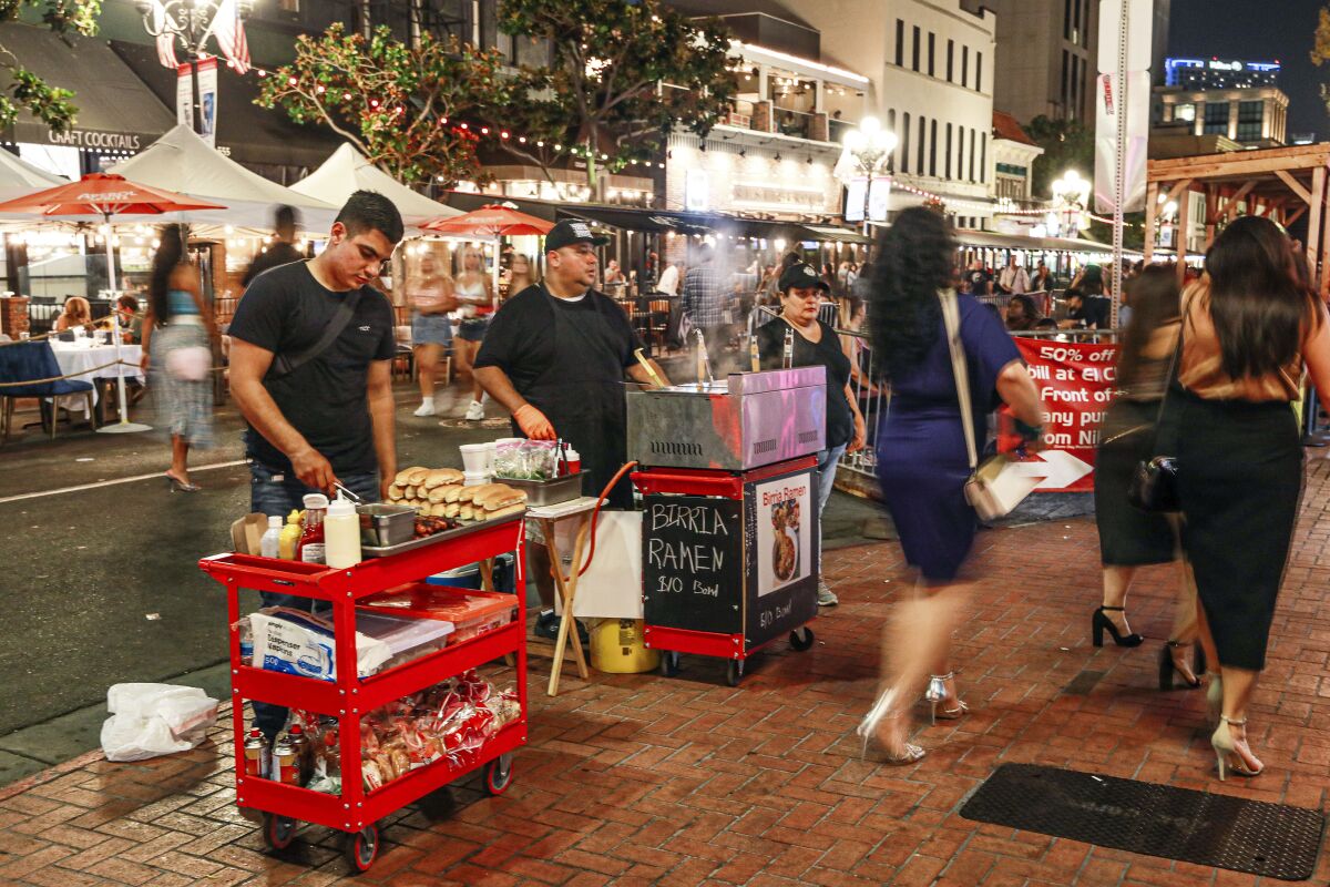Street vendors sell food along 5th Avenue in the Gaslamp Quarter on Saturday, August 27, 2021.