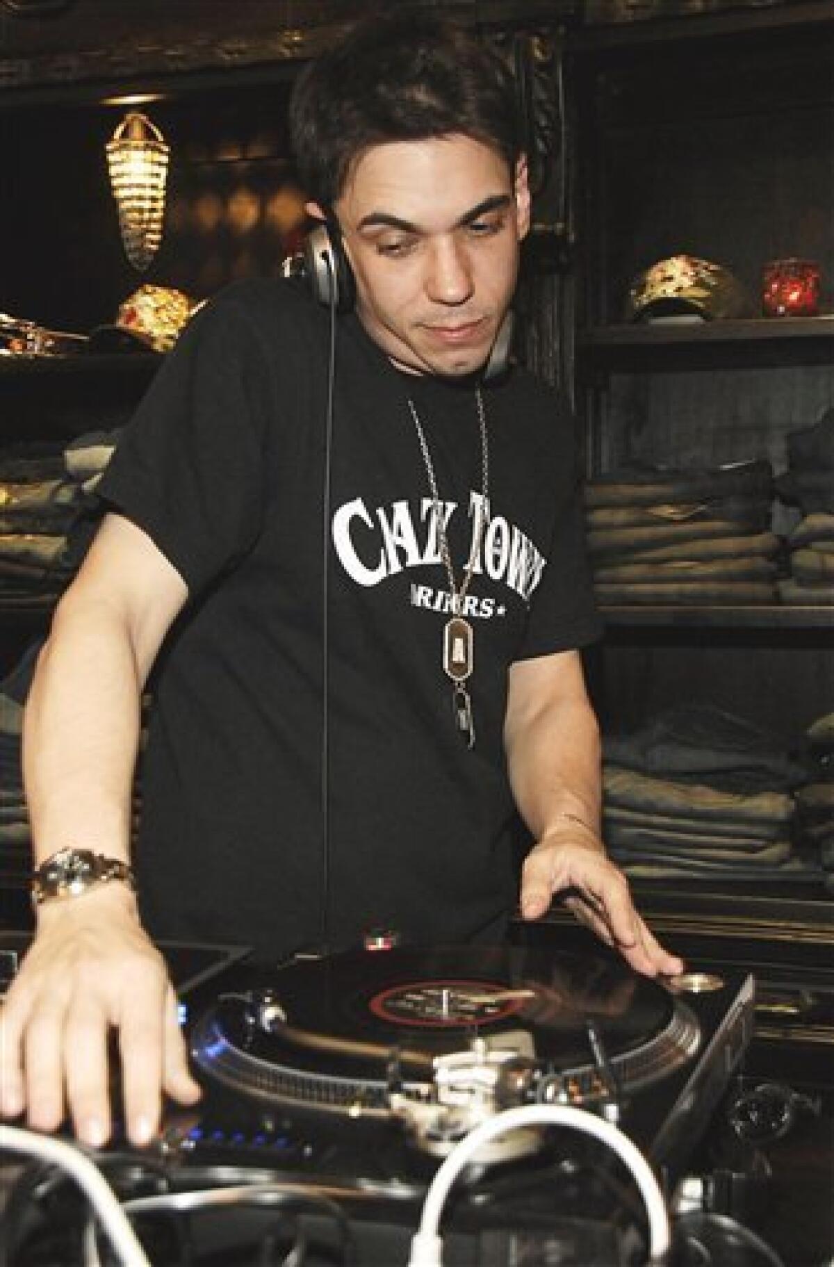 In this March 18, 2006 photo, celebrity disc jockey Adam Goldstein, also known as DJ AM, spins records at the Moody Blues clothing store opening in Scottsdale, Ariz. A law enforcement official says the celebrity disc jockey known as DJ AM has been found dead in a New York City apartment. (AP Photo/Dan Steinberg)