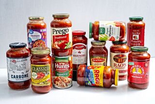 Twelve kinds of marinara sauces sold at grocery stores.