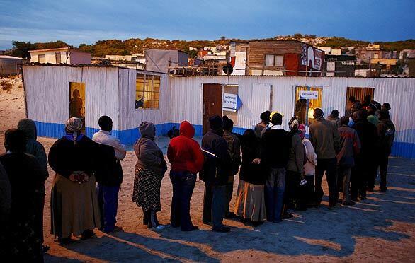 South African voters line up at dawn to cast their ballots in national elections in Cape Town, South Africa. South Africans vote for a new president in this fourth democratic election since the end of white minority rule in 1994. The election comes at a time when many voters are disillusioned at continuing high unemployment, crime and a lack of decent housing.