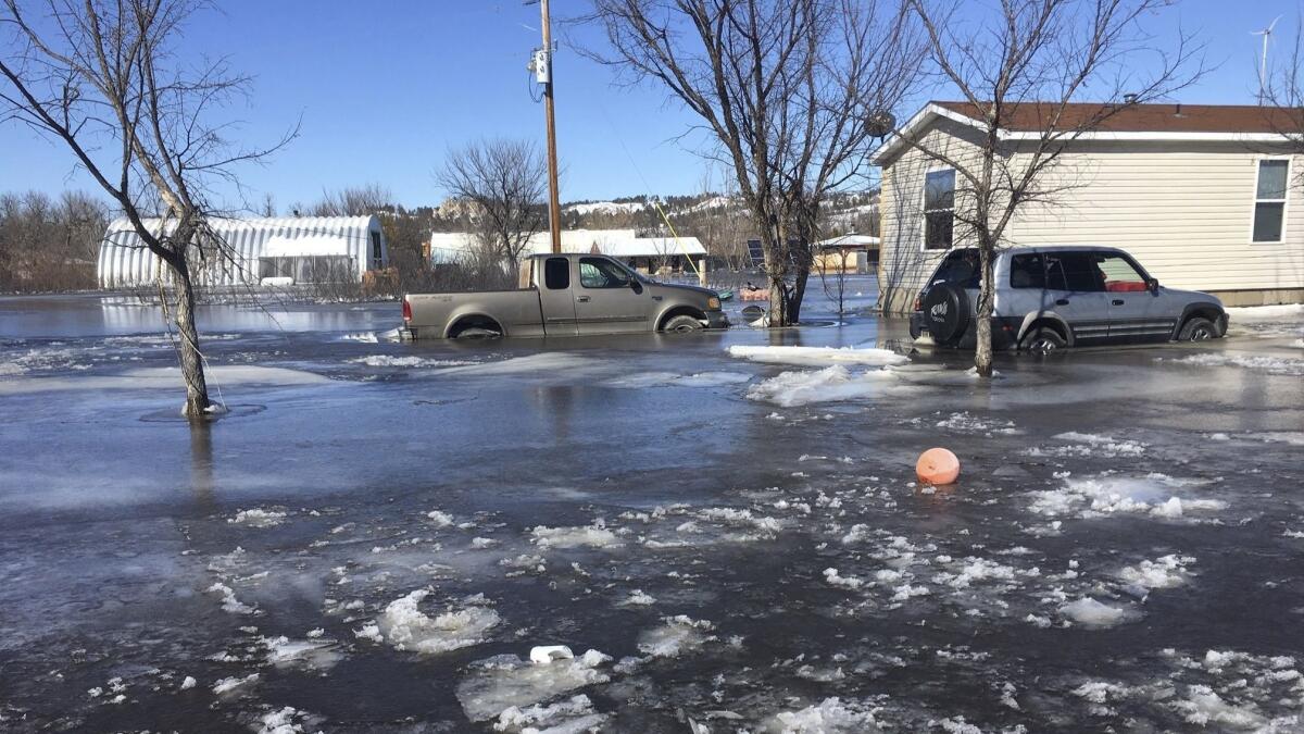 Plains and Midwest states are bracing for another massive winter storm Wednesday and Thursday and the prospect of renewed flooding when the snow melts.