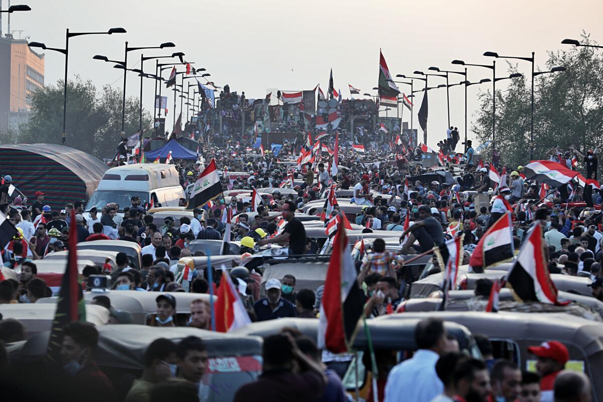 Anti-government protesters in Iraq gather on a closed bridge during ongoing protests in Baghdad on Nov. 3, 2019.