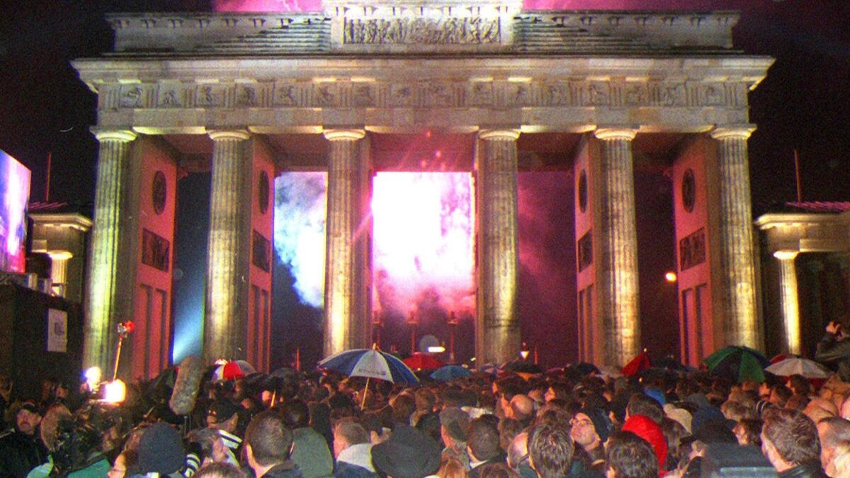 Fireworks light the sky over Brandenburg Gate in 1999, where thousands of people gathered to celebrate the 10th anniversary of the fall of the Berlin Wall.