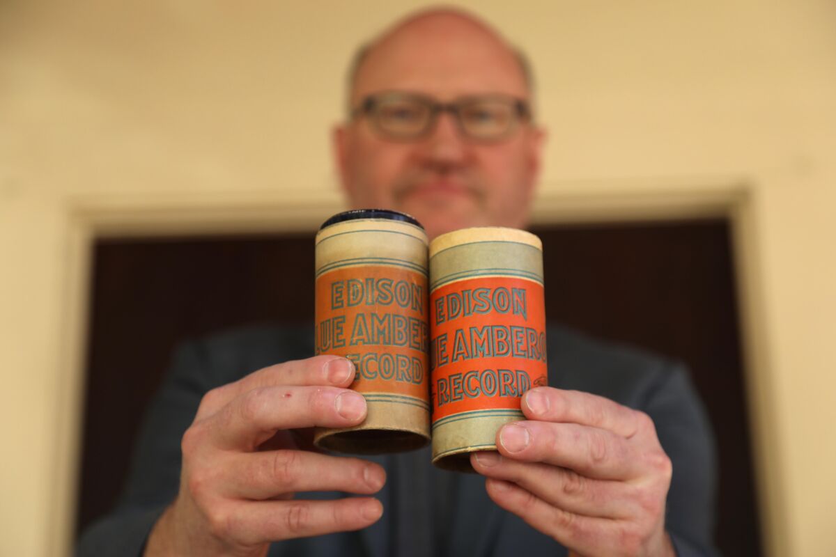 David Seubert of UCSB holds two rare Edison wax cylinders
