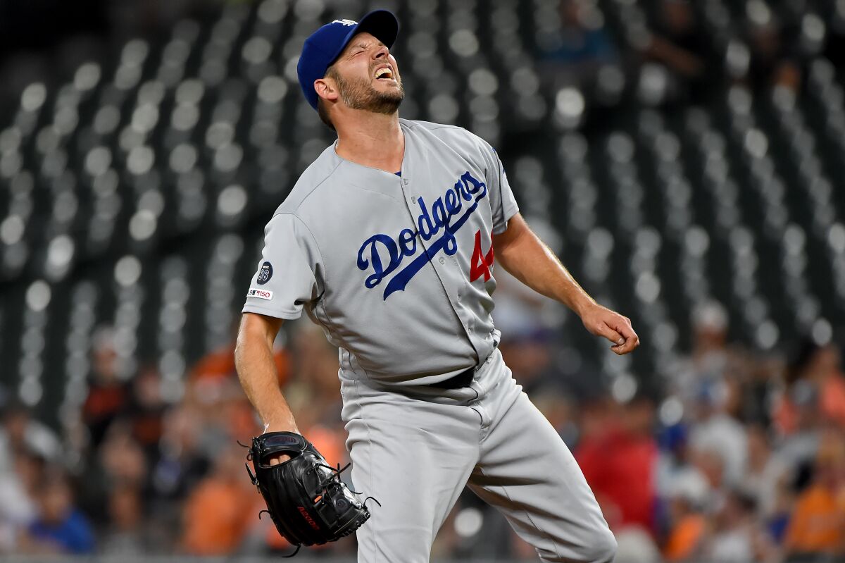 Dodgers left-hander Rich Hill reacts after throwing a first-inning pitch against the Orioles on Sept. 12, 2019.