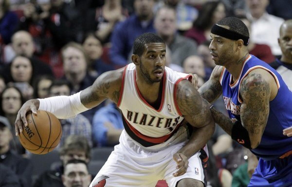 Portland's LaMarcus Aldridge backs in on New York's Kenyon Martin during the first half of a game on Nov. 25.